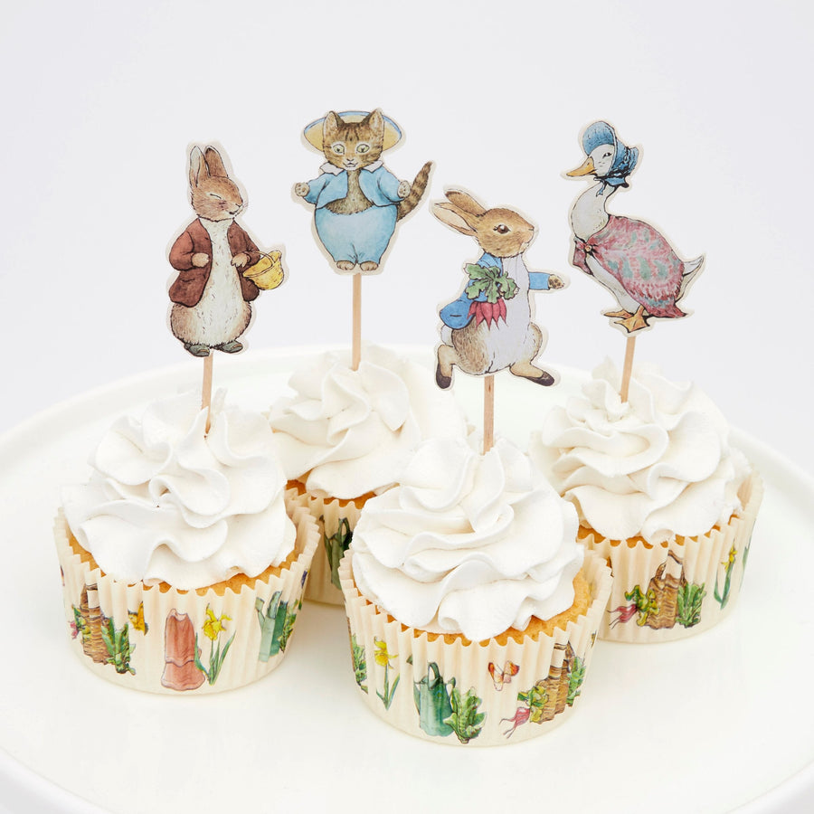Illustrated party tableware and decorations arranged on a celebration table